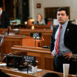 In this Feb. 18, 2016, photo, Neb. State Sen. John Murante of Gretna stands in the Legislative Chamber in Lincoln, Neb. Sen. Murante is among Republicans in Nebraska backing an idea that’s almost unthinkable in the current hyperpolarized climate: turning over political map drawing to a new independent commission.