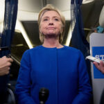 Democratic presidential candidate Hillary Clinton pauses while she gives remarks on the explosion in Manhattan's Chelsea neighborhood onboard her campaign plane at Westchester County Airport, in White Plains, N.Y., Saturday, Sept. 17, 2016.