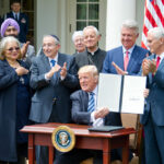 United States President Donald J. Trump signs an Executive Order "Promoting Free Speech and Religious Liberty" in the Rose Garden of the White House in Washington, DC on Thursday, May 4, 2017.