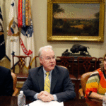 Dr. Douglas Lake, from Iowa, left, listens as Health and Human Services Secretary Tom Price, speaks, with Candace Fowler, from Missouri, at right, during a listening session in the Roosevelt Room of the White House,