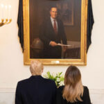 President and Malania Trump viewing portrait of the late President Bush displayed in The White House