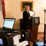 President Donald J. Trump, joined by senior White House staff, stands at a podium in the Map Room at the White House, during a prep sessions for President's State of the Union speech, Tuesday, Jan 30, 2018, in Washington, D.C.