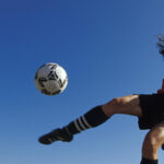Woman Kicking Soccer Ball