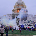 6th Jan, 2021. the U.S. Capitol Building is clouded by tear gas during protest