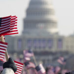 flag waving crowds at Presidential Inauguration at Capitol Building, Washington D.C.