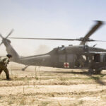 U.S. Army soldiers move towards a Medevac helicopter in southern Afghanistan