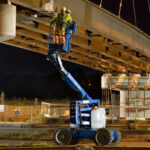 Construction work being done on a highway overpass bridge