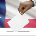 Voting concept - Ballot box with Texas state flag on background