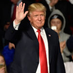 Donald Trump waves to the crowd during a political rally