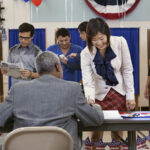 Voters registering at polling place