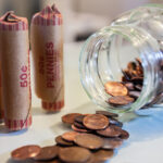 American coins in loose change and in paper rolls prepared for currency exchange at the bank.