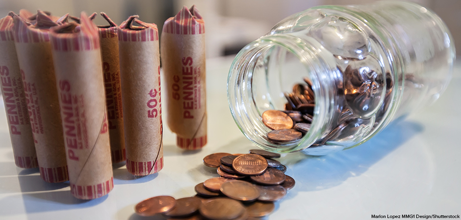 American coins in loose change and in paper rolls prepared for currency exchange at the bank.