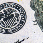 macro photo of federal reserve system symbol on hundred dollar bill